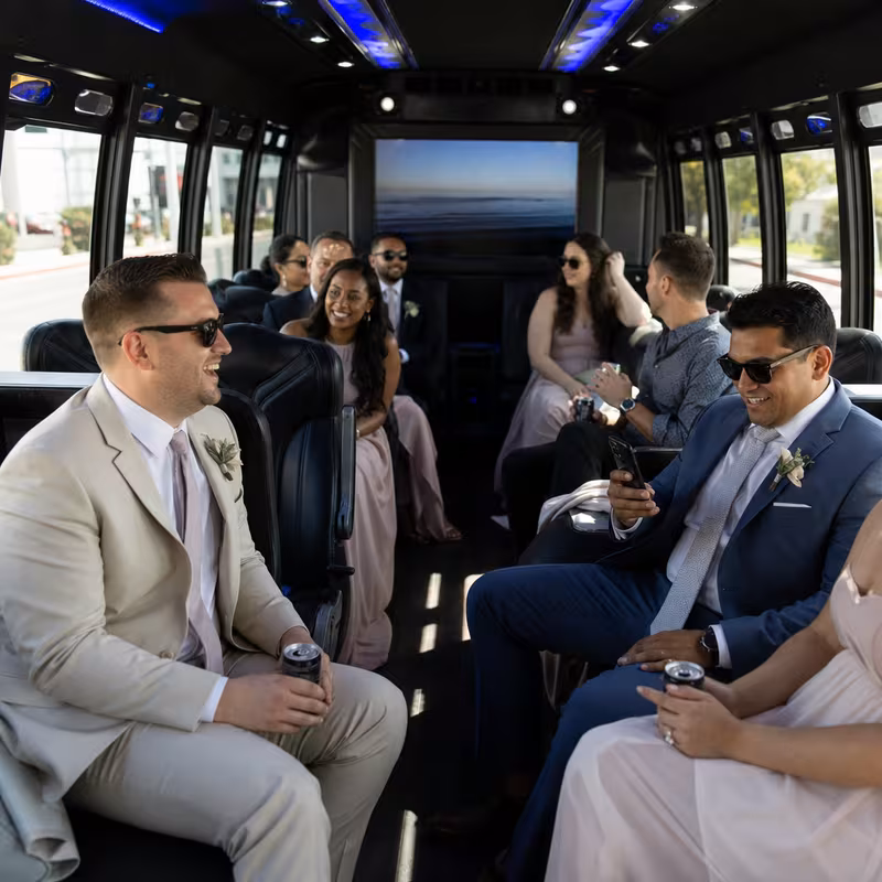 Wedding guests seated inside a Las Vegas party bus