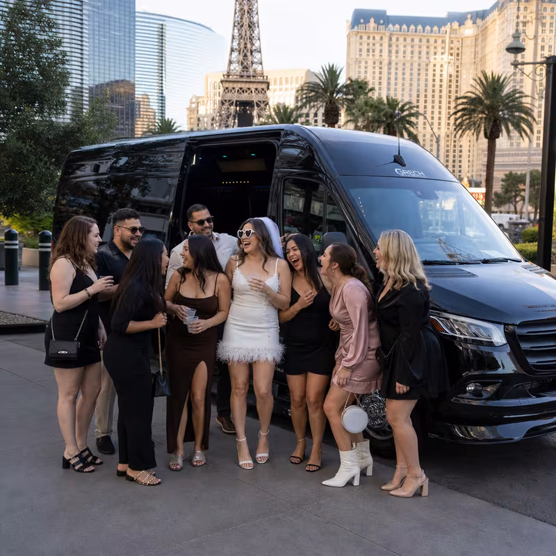 Group boarding a white charter bus for Bachelor & Bachelorette Transportation transportation in Las Vegas