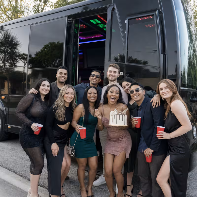 Party bus interior with wraparound leather seating and LED lighting in Las Vegas