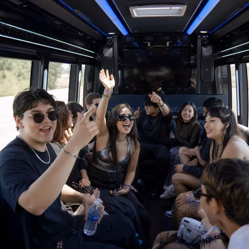 Passengers loading luggage while boarding an Las Vegas group shuttle
