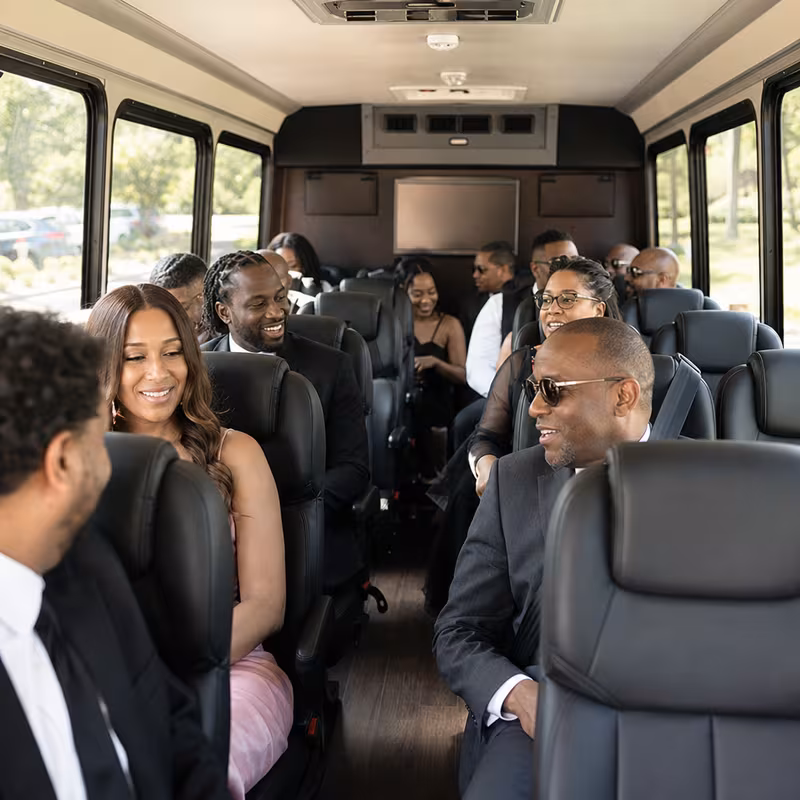 Group boarding a white charter bus for Private Event Transportation transportation in Las Vegas