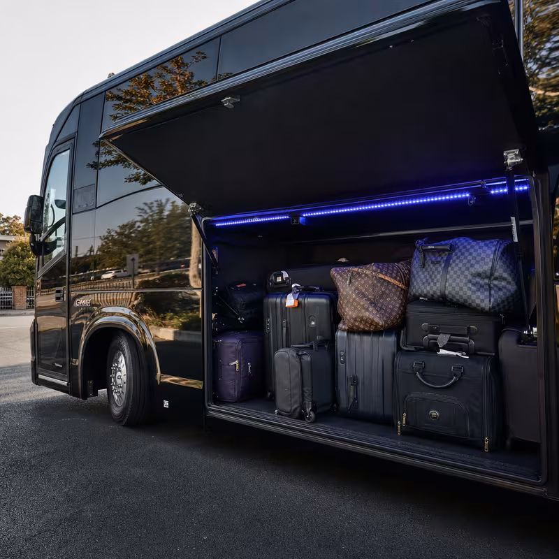 Party bus interior with wraparound leather seating and LED lighting in Las Vegas