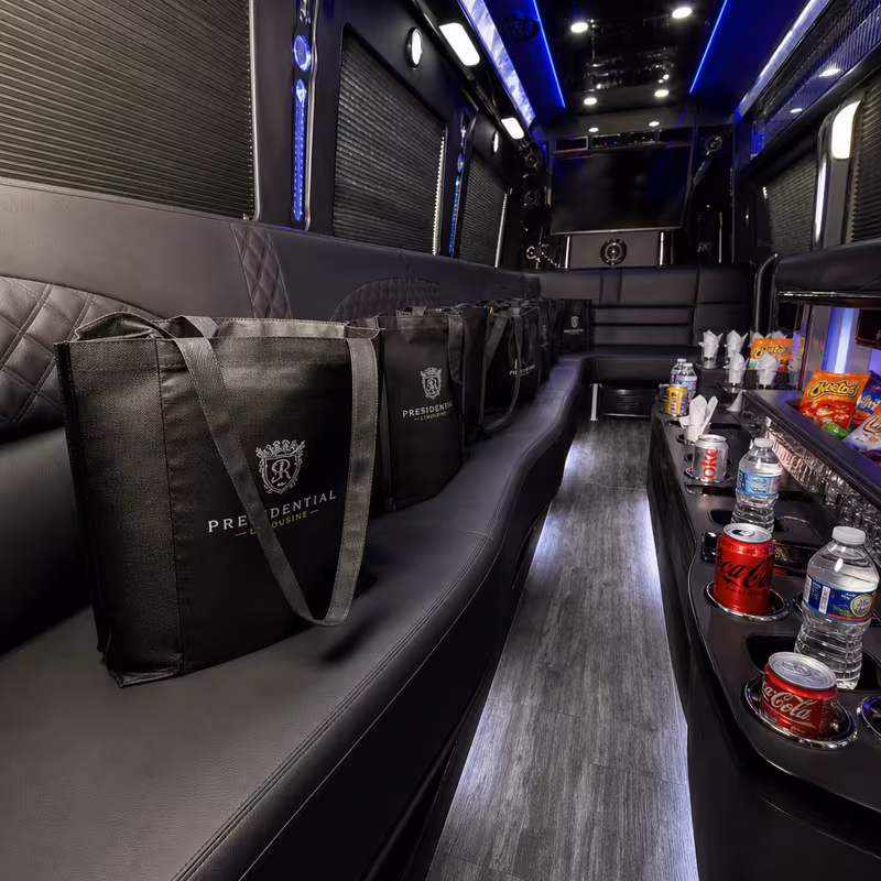 Party bus interior with wraparound leather seating and LED lighting in Las Vegas
