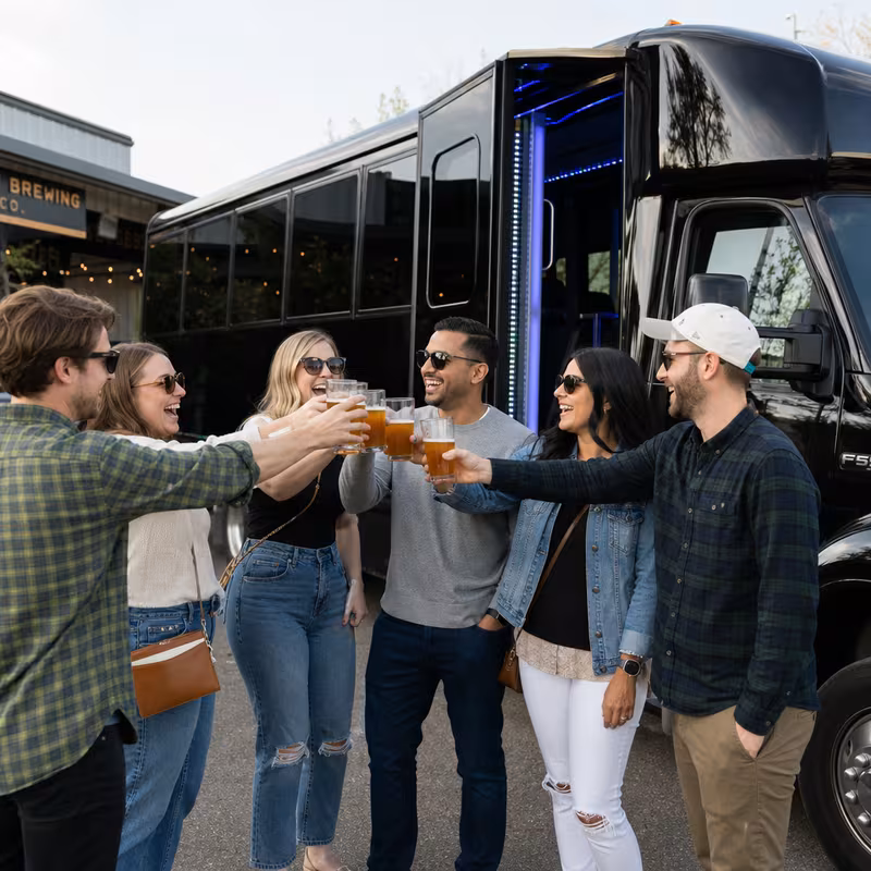 Passengers loading luggage while boarding an Las Vegas group shuttle